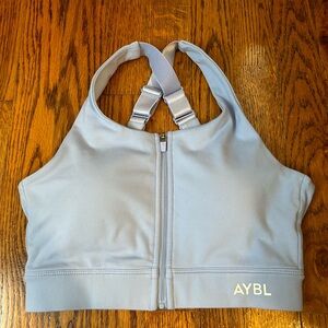light blue zip up sports bra